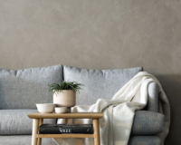 couch with blanket draped over it