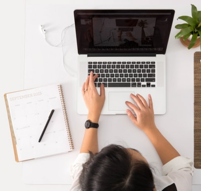 woman working on her laptop at a desk