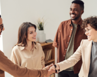 types of sales persons shaking hands in a group