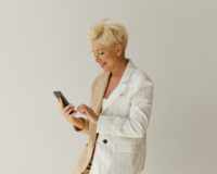 middle aged woman using relationship selling techniques on cell phone