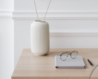 vase and tablet on desk