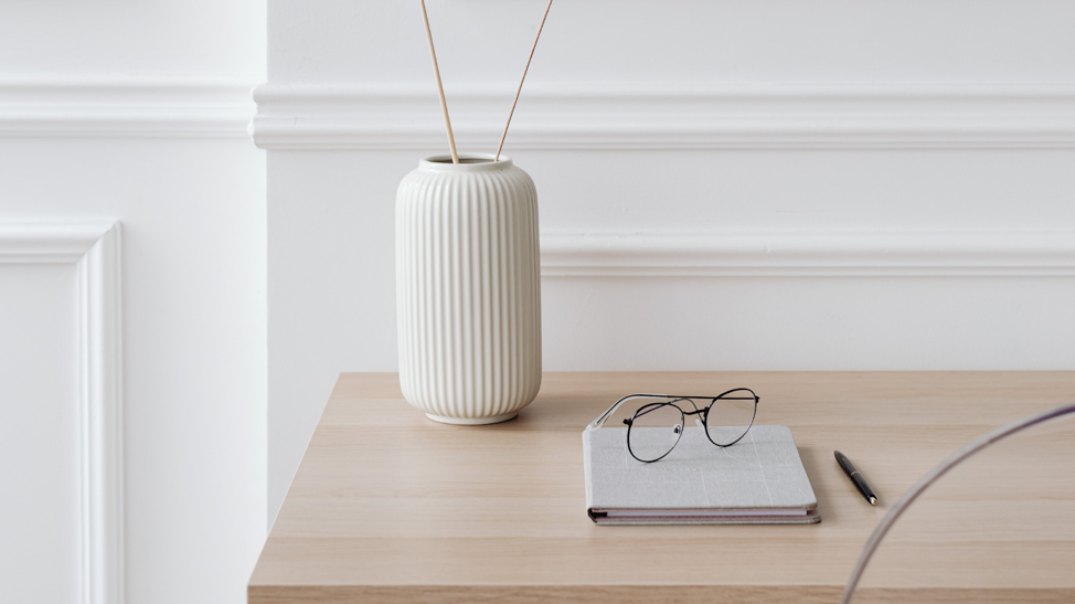 vase and tablet on desk
