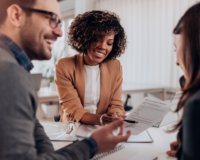 group of professionals working on a company-generated leads plan