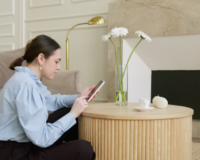 woman learning video editing tips on her smartphone