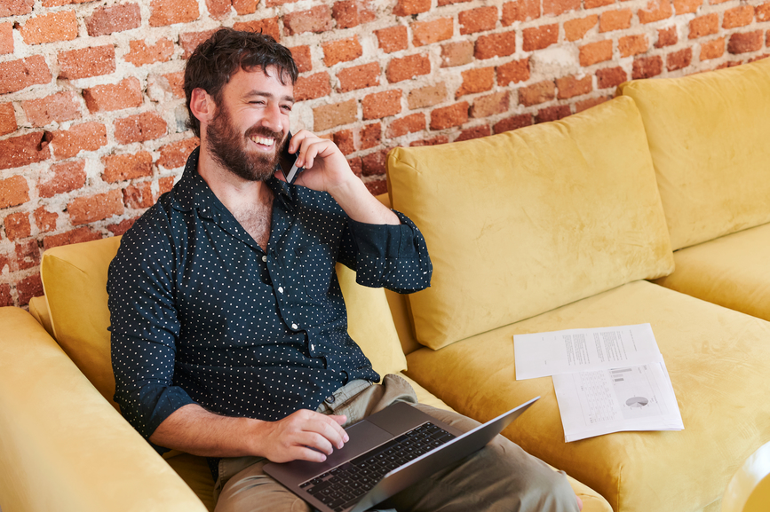 man building trust with clients while talking on the phone